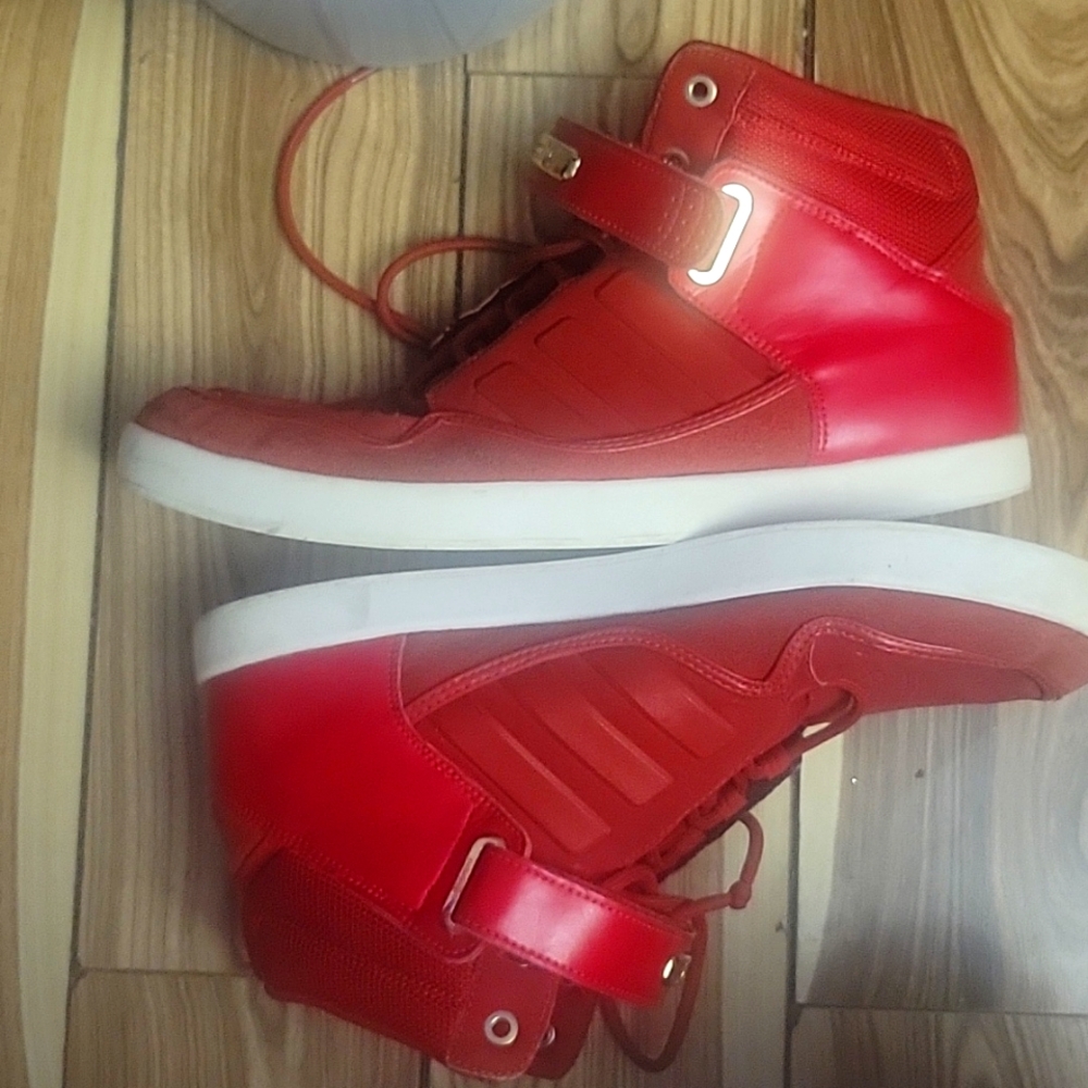 Red addidas mid lows with velcro strap